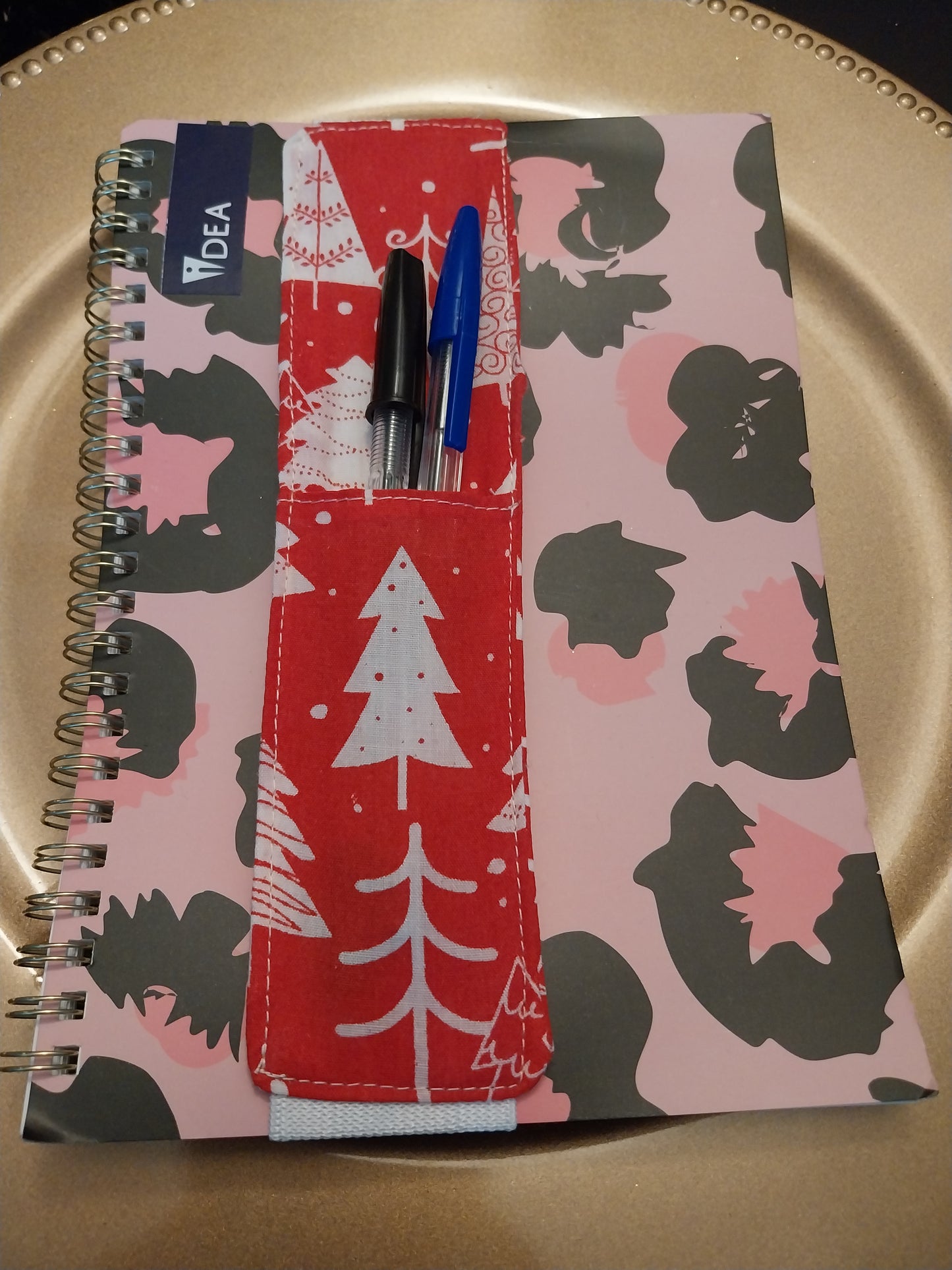 Notebook pen holder