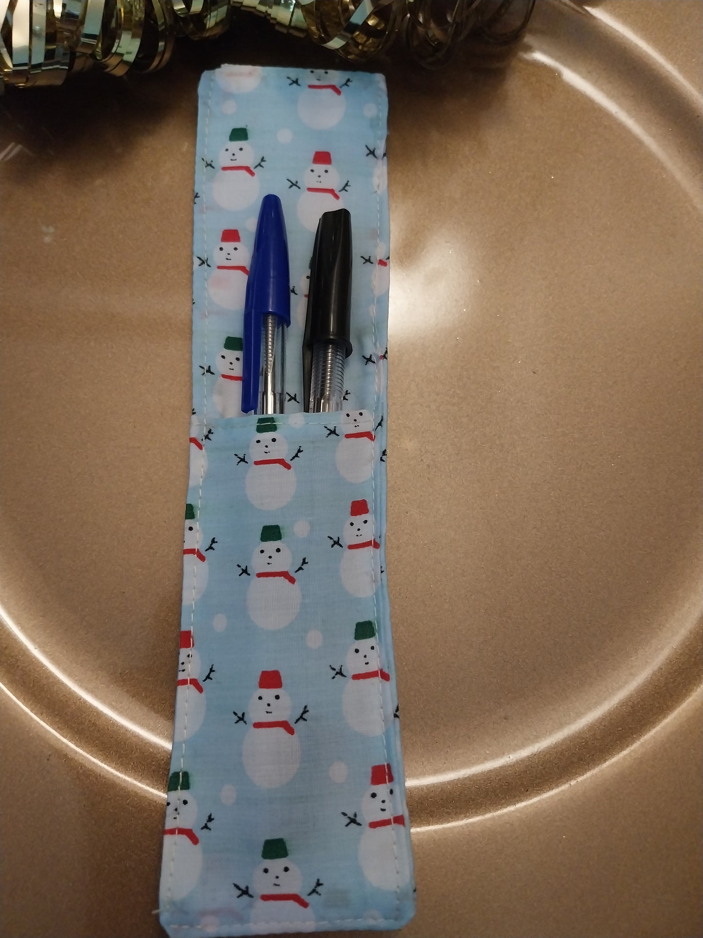 Notebook pen holder