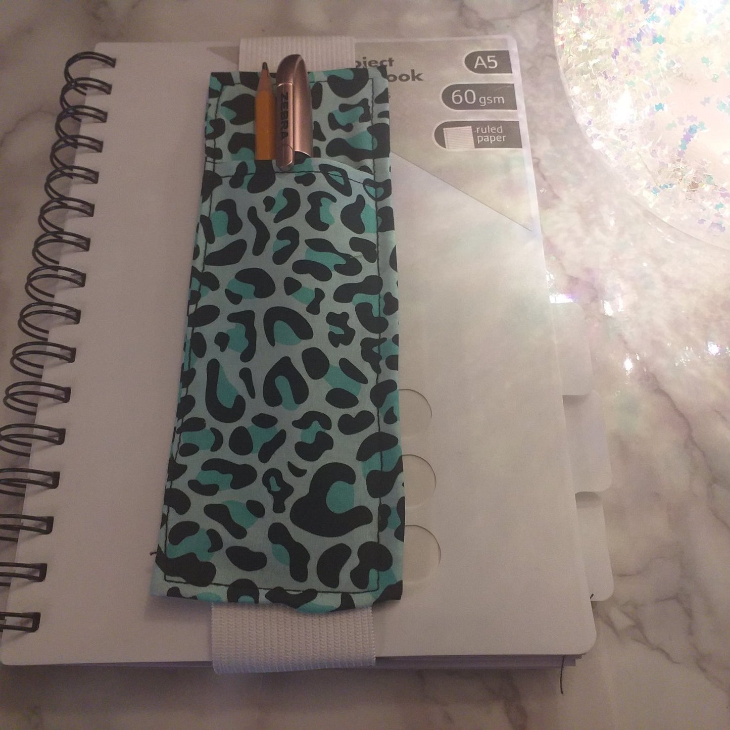 Notebook pen holder