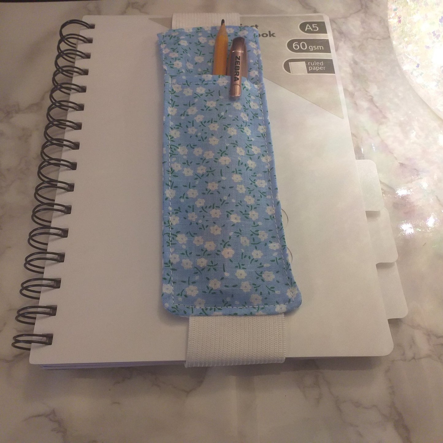 Notebook pen holder
