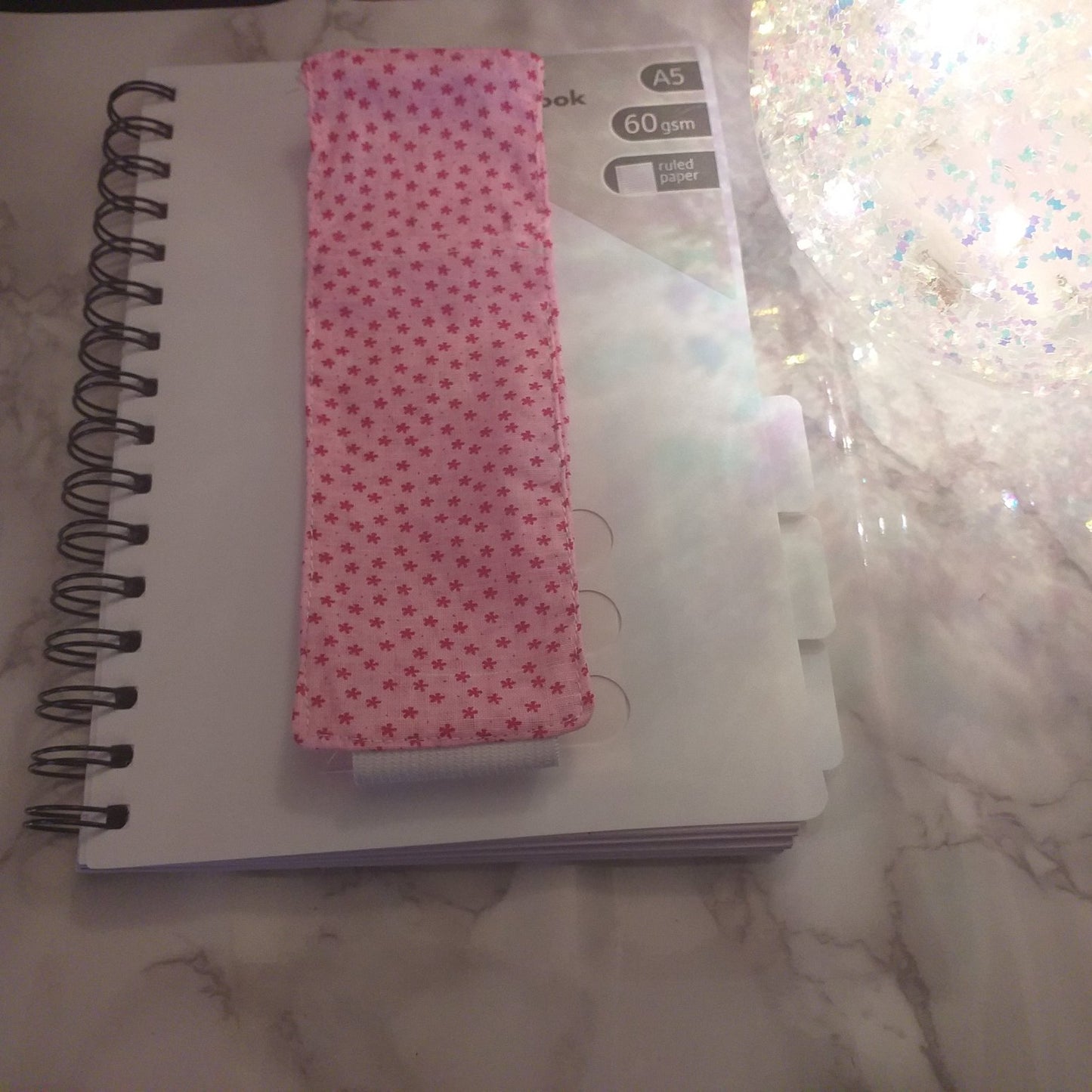 Notebook pen holder