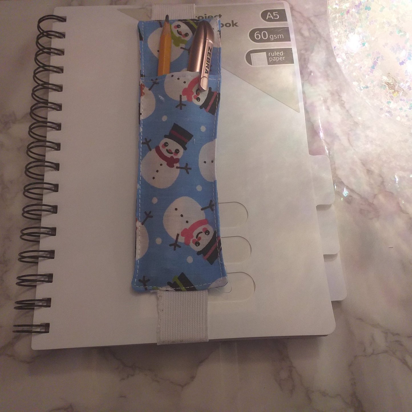 Notebook pen holder