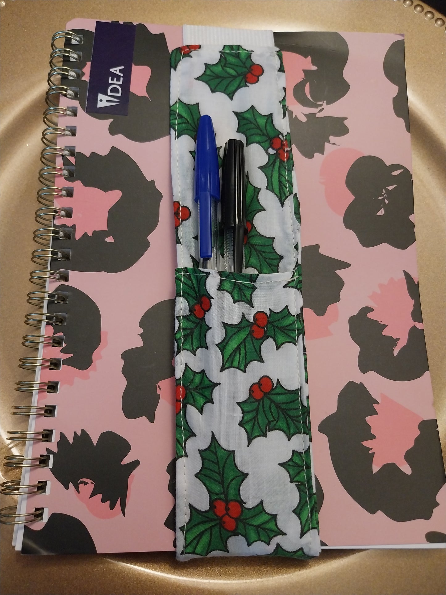 Notebook pen holder