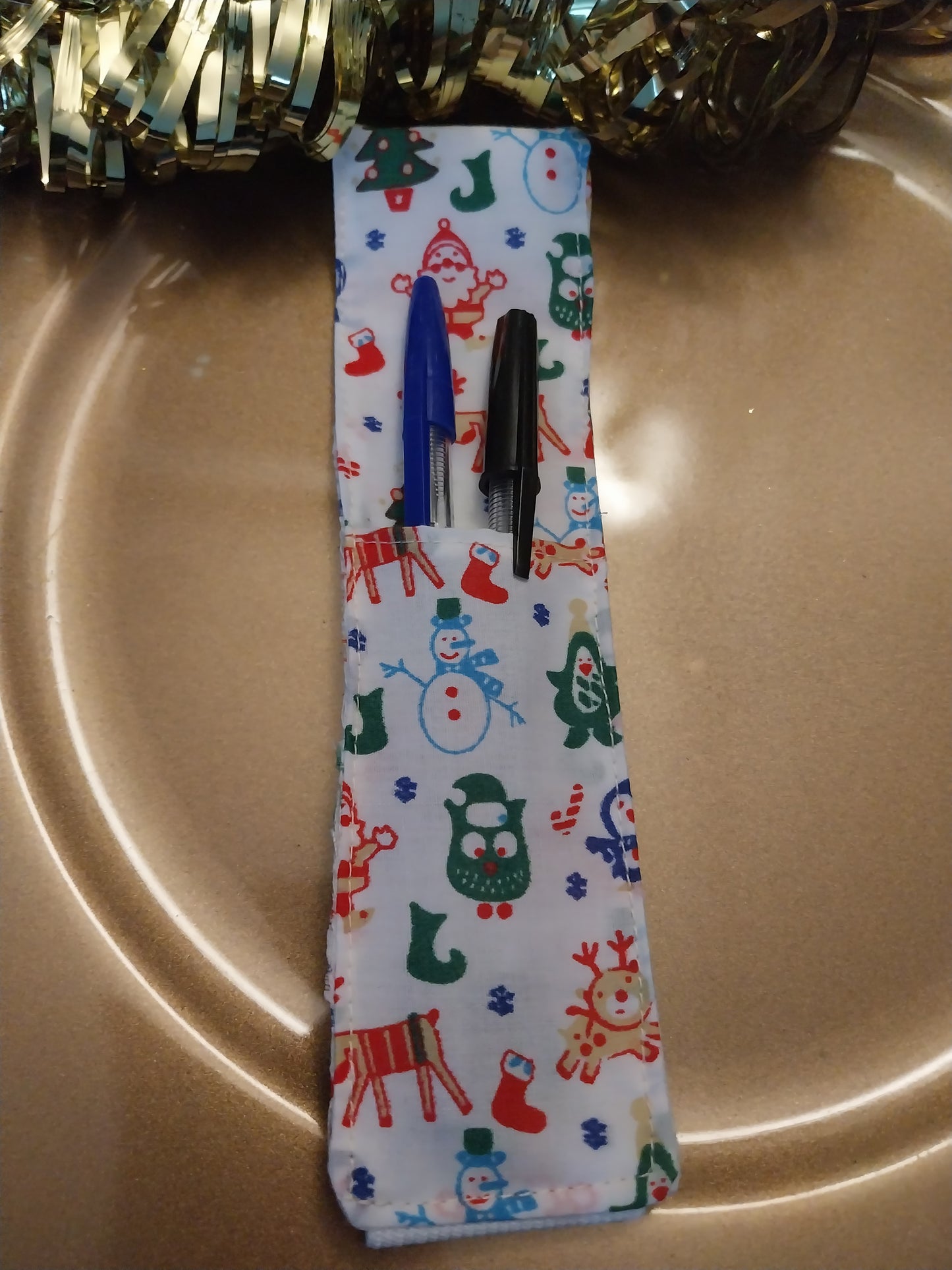 Notebook pen holder