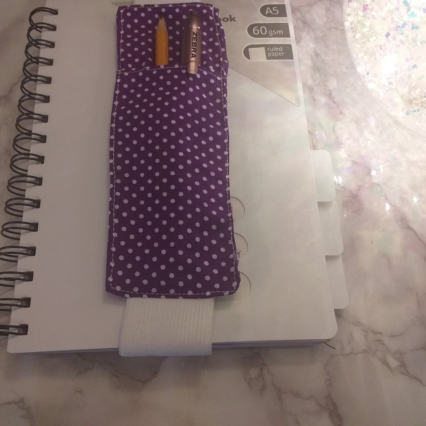 Notebook pen holder