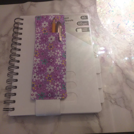 Notebook pen holder