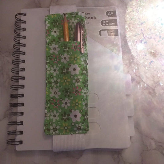 Notebook pen holder