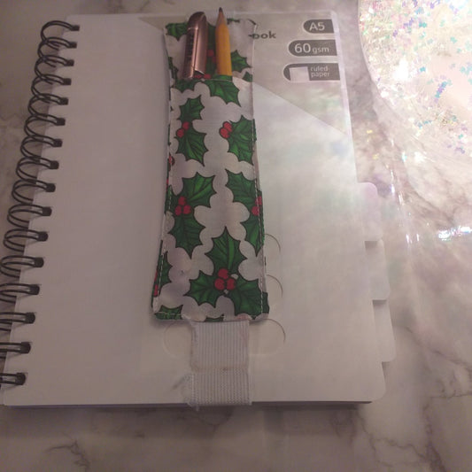 Notebook pen holder