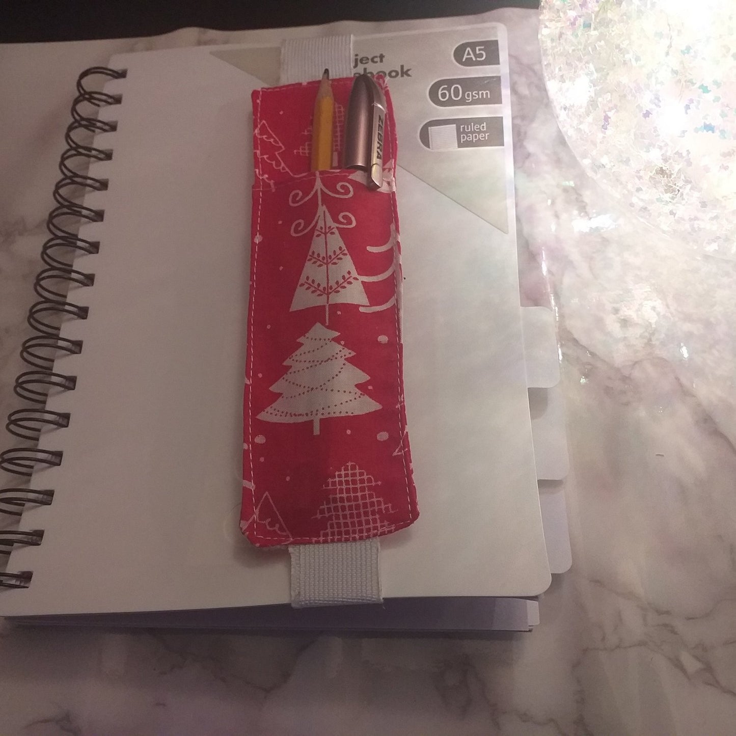 Notebook pen holder
