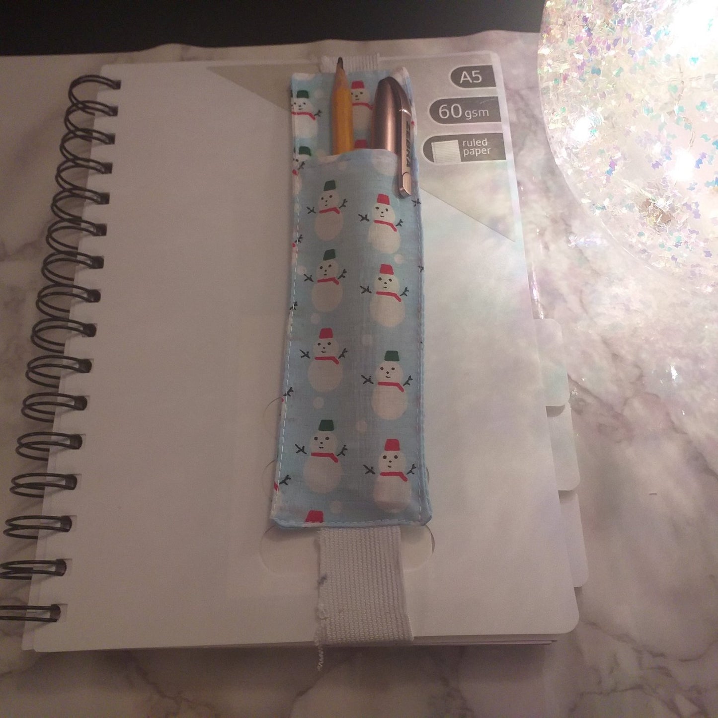 Notebook pen holder