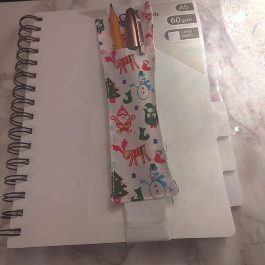 Notebook pen holder