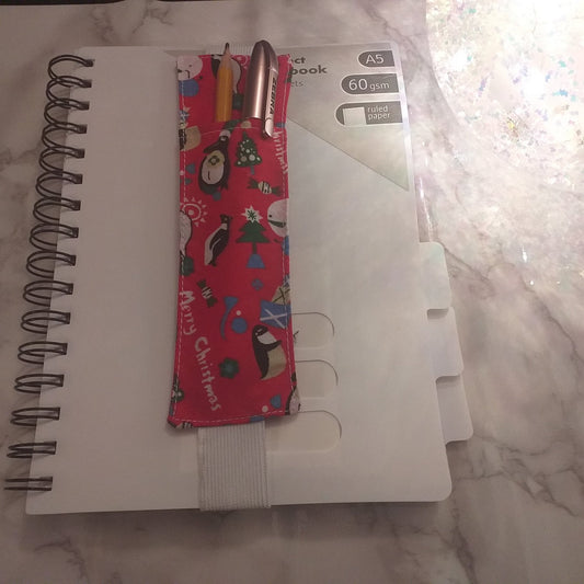 Notebook pen holder
